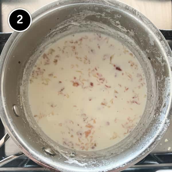 Milk simmering with Spanish jamon