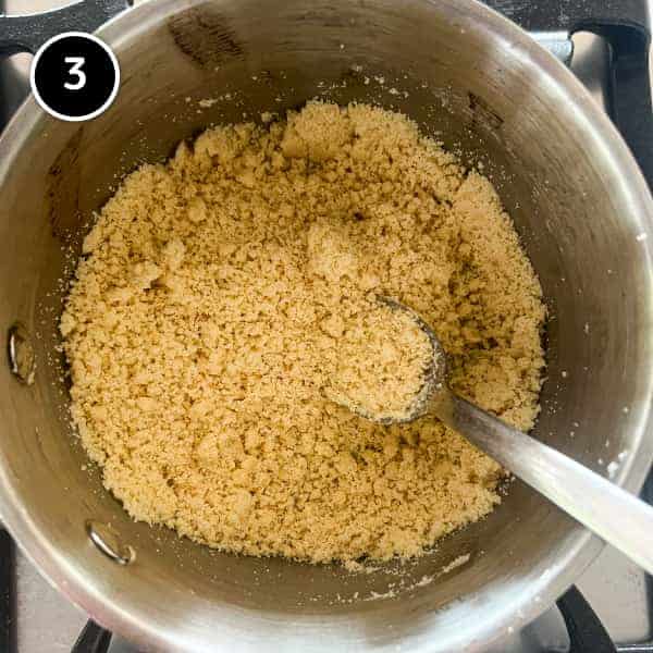 Small crumbs of butter with flour cooking in a pan