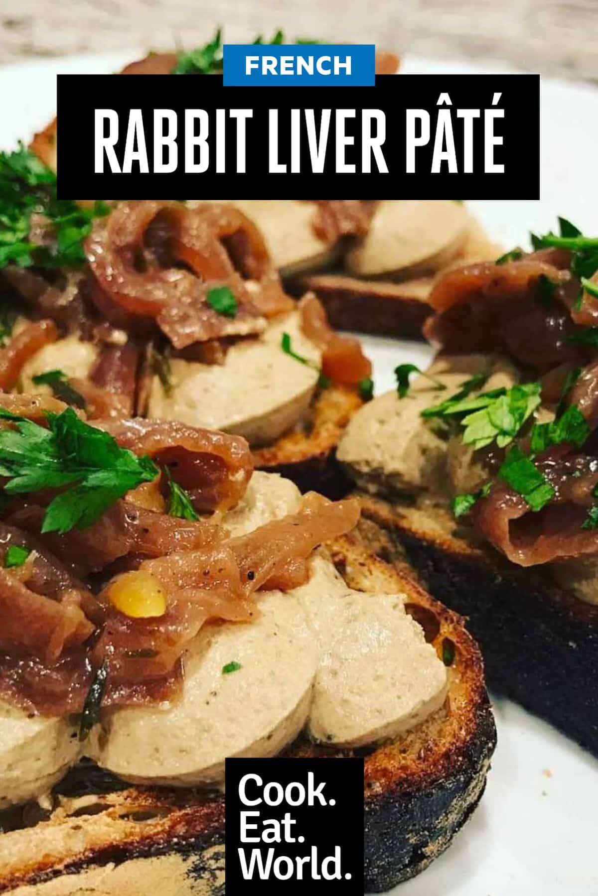 Rabbit liver pate spread on sourdough toast. Topped with caramelised onions and fresh parsley