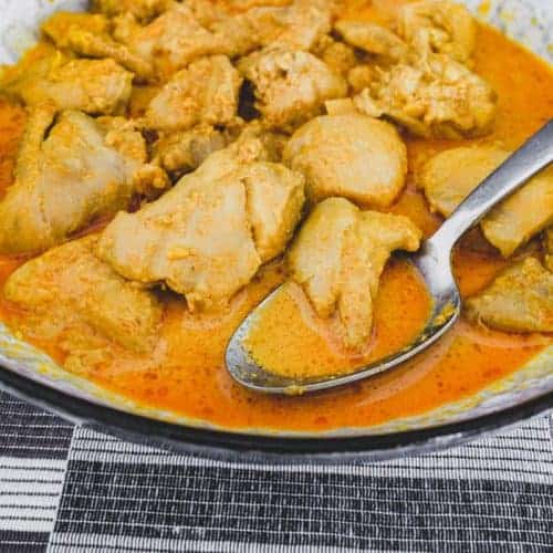 Chicken cooked in coconut milk with Malaysian aromatics to make Nyonya Chicken Curry (Ayam Kleo)