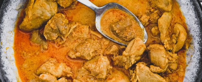 Chicken cooked in coconut milk with Malaysian aromatics to make Nyonya Chicken Curry (Ayam Kleo)