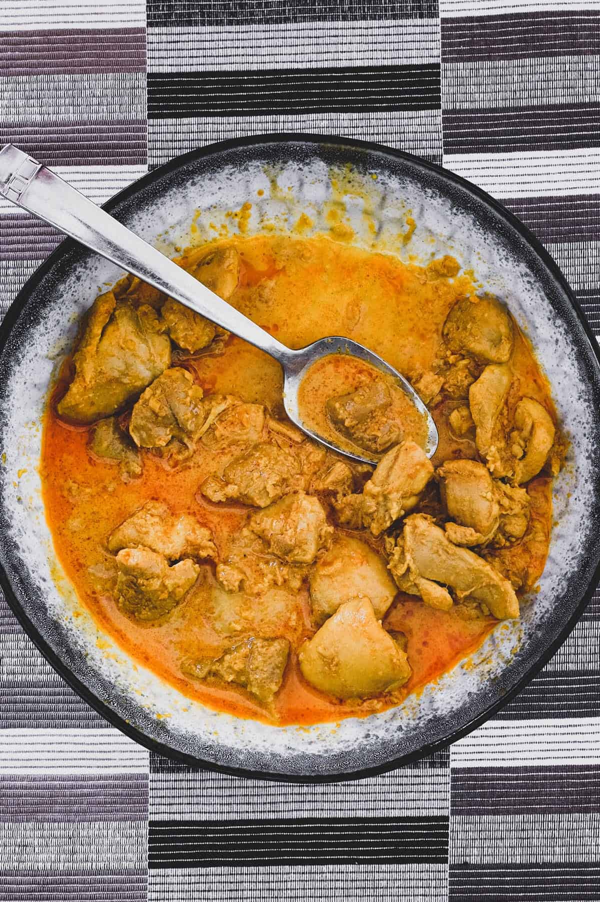 Chicken cooked in coconut milk with Malaysian aromatics to make Nyonya Chicken Curry (Ayam Kleo)