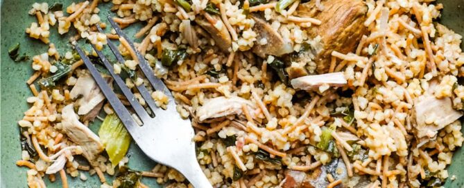 A bowl of Turkish bulgur pilav with a fork