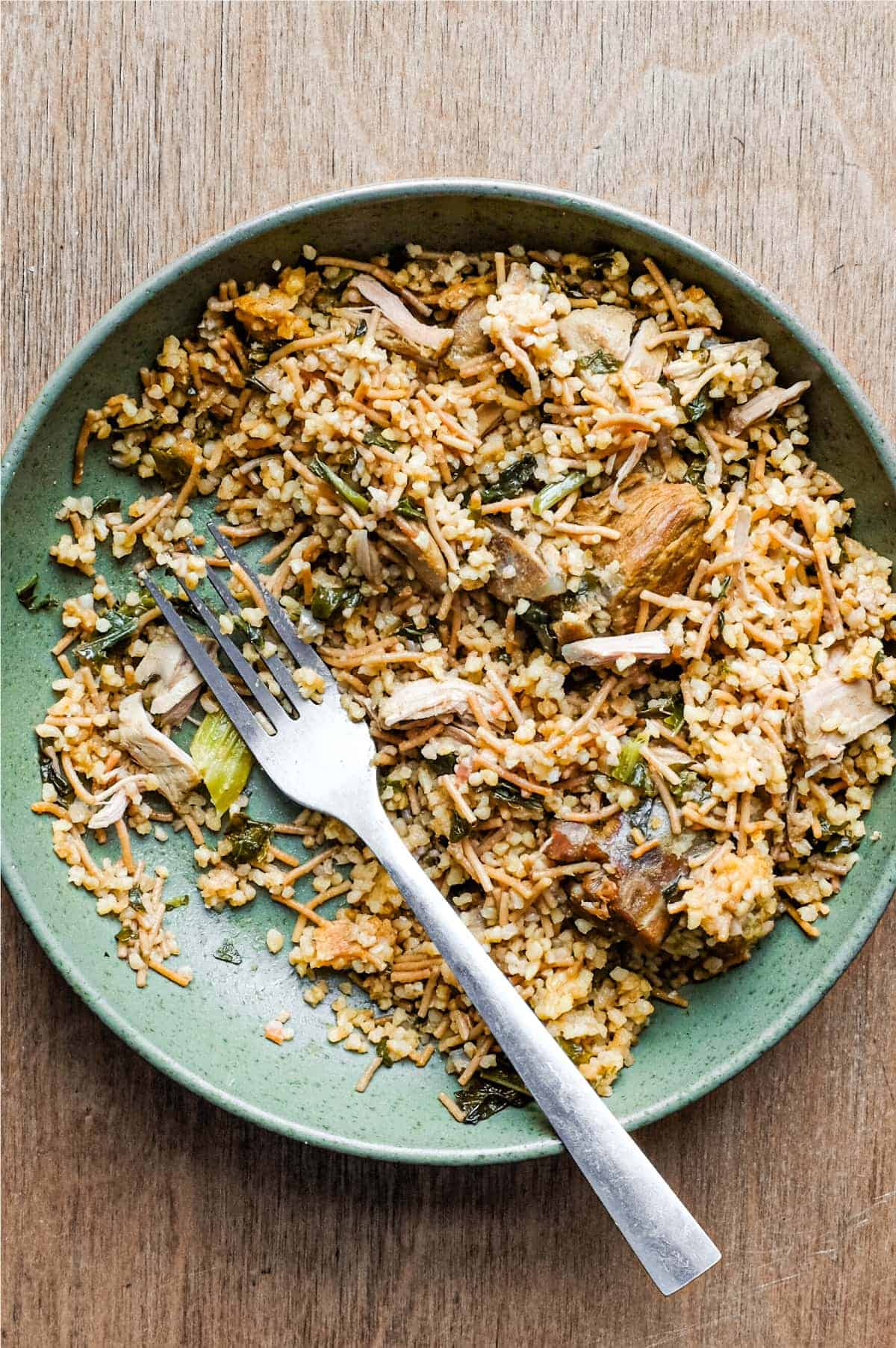 A bowl of Turkish bulgur pilav with a fork