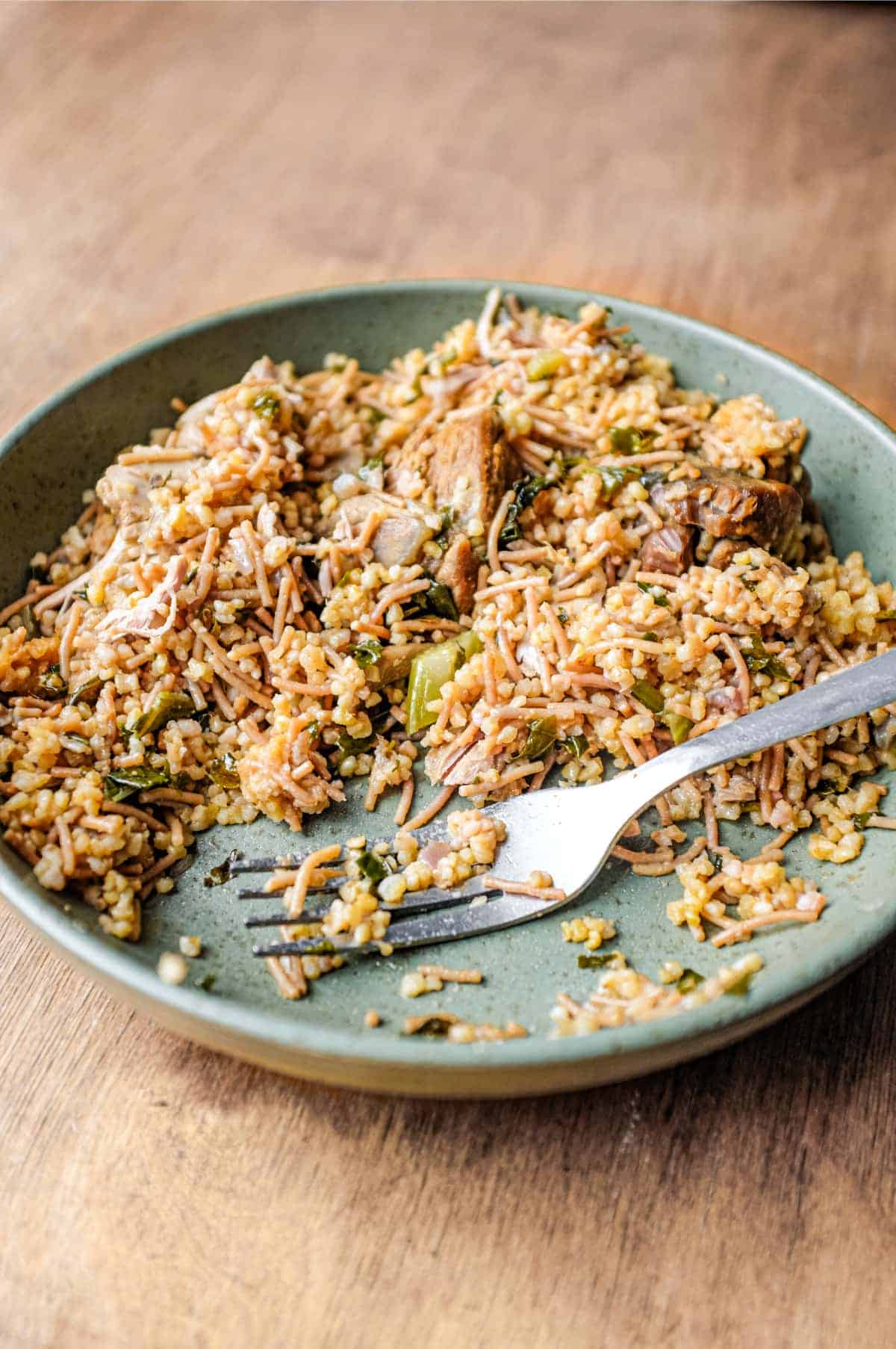 A bowl of Turkish bulgur pilav with a fork