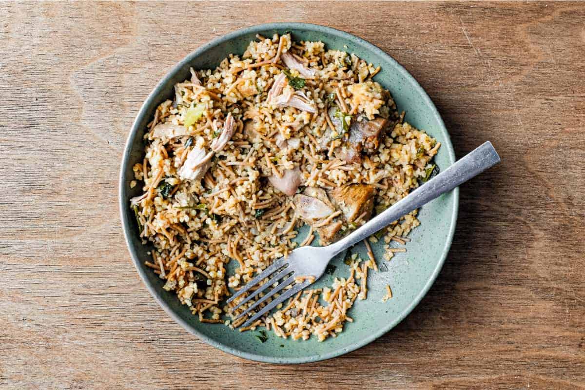 A bowl of Turkish bulgur pilav with a fork