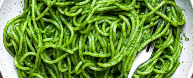 A bowl of spaghetti in a green puree of cavolo nero cabbage