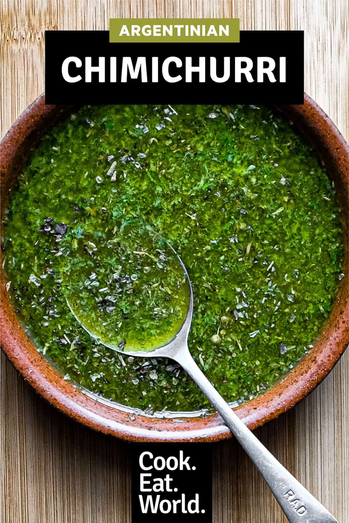 A small bowl of chimichurri sauce with a spoon