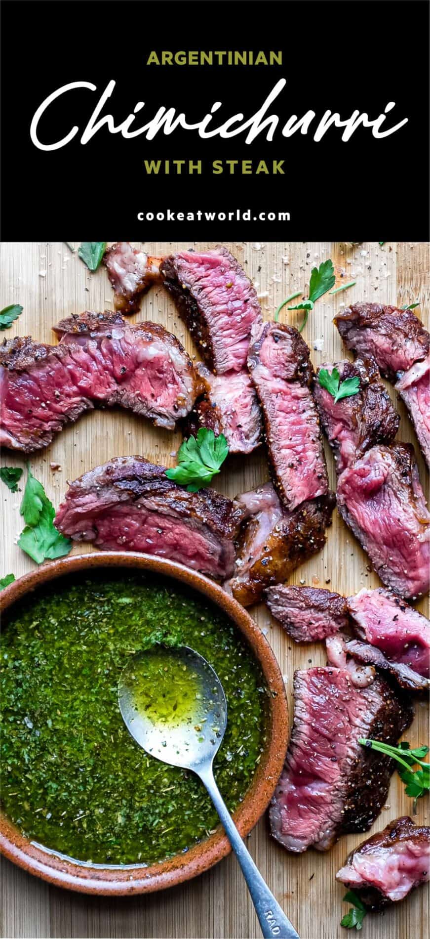 A small bowl of chimichurri sauce with a spoon sits alongside slices of rare cooked ribeye steak