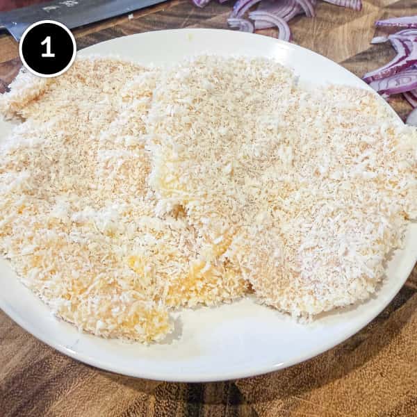 Chicken Katsudon | cookeatworld.com Breaded chicken fillets ready for deep frying into katsudon