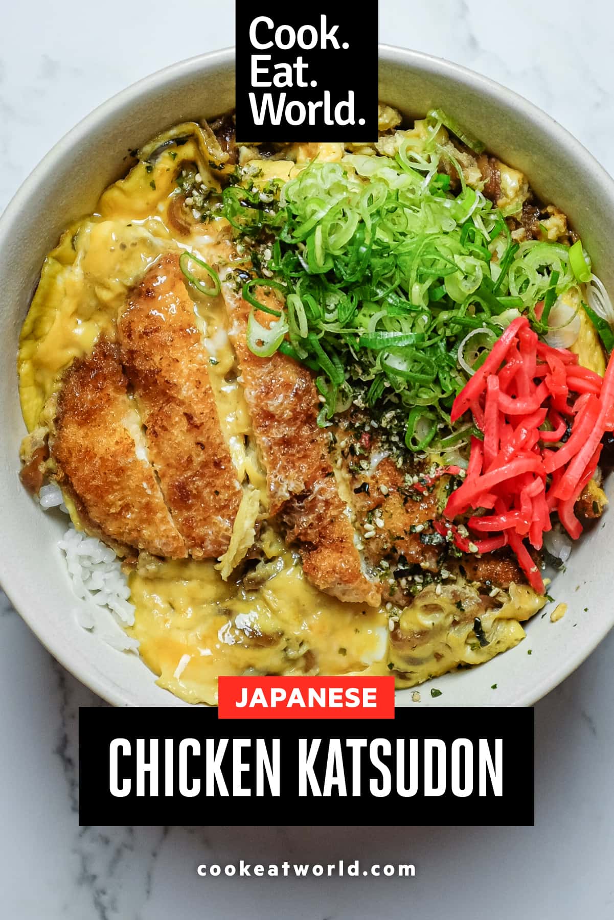Bowl of Japanese chicken katsudon garnished with spring onions and furikake
