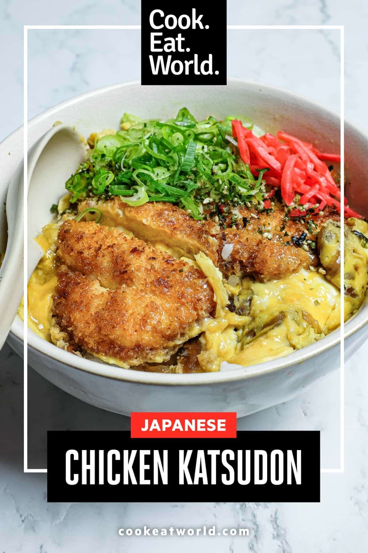 Japanese chicken katsudon rice bowl topped with golden katsu, silky egg and pickled ginger