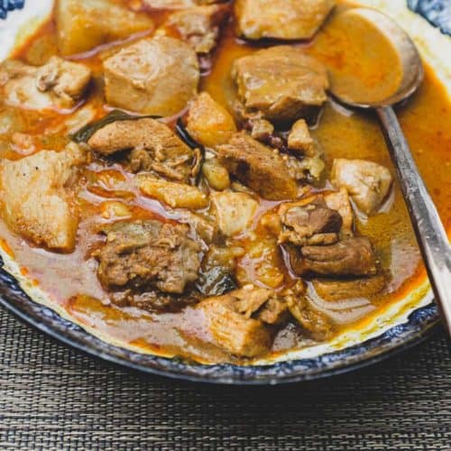 Malaysian Chicken Curry in a bowl with a spoon