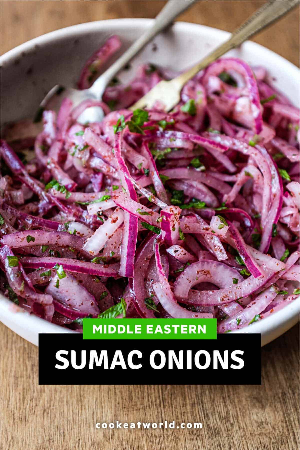 A small bowl of Sumac Onions with a small serving fork and spoon