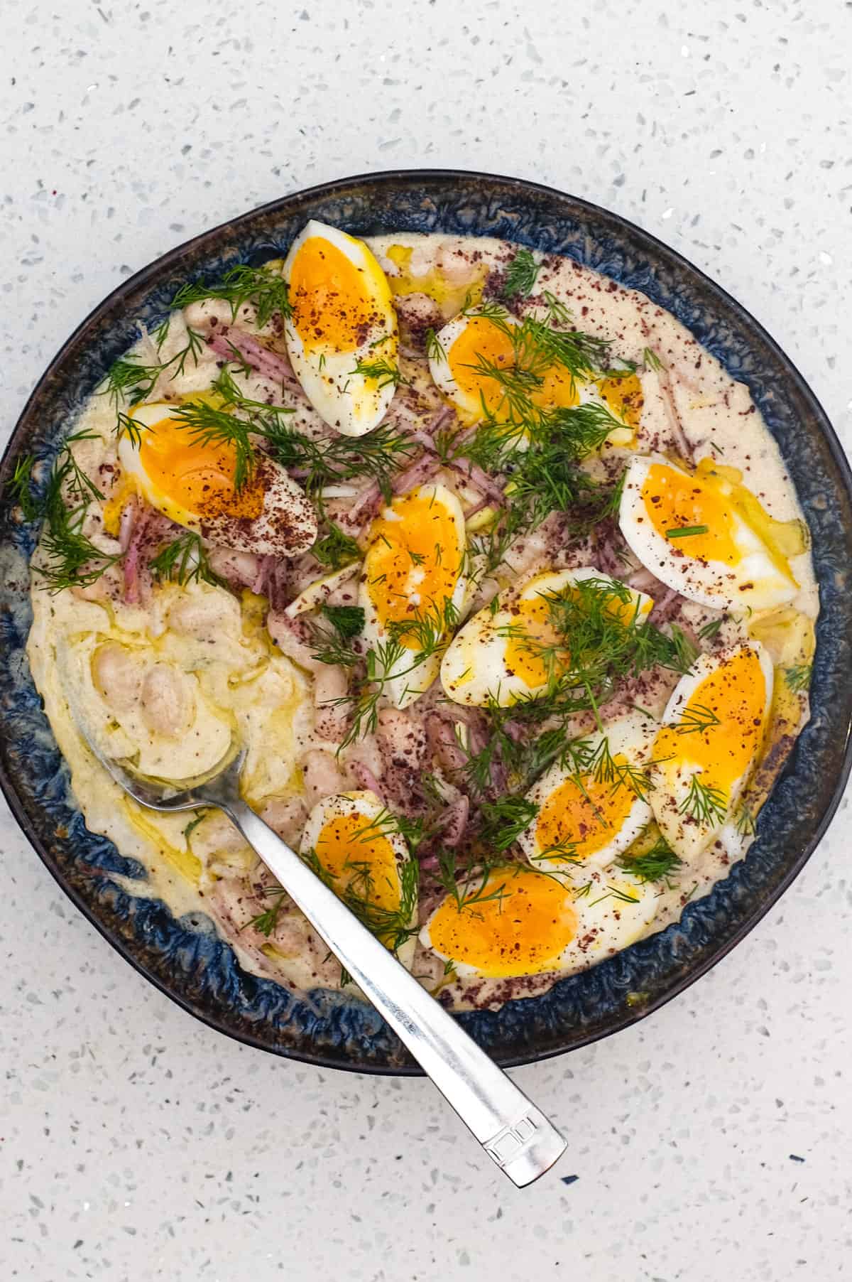 A Turkish bean salad with eggs, onion and dill - Fasulye Piyaz