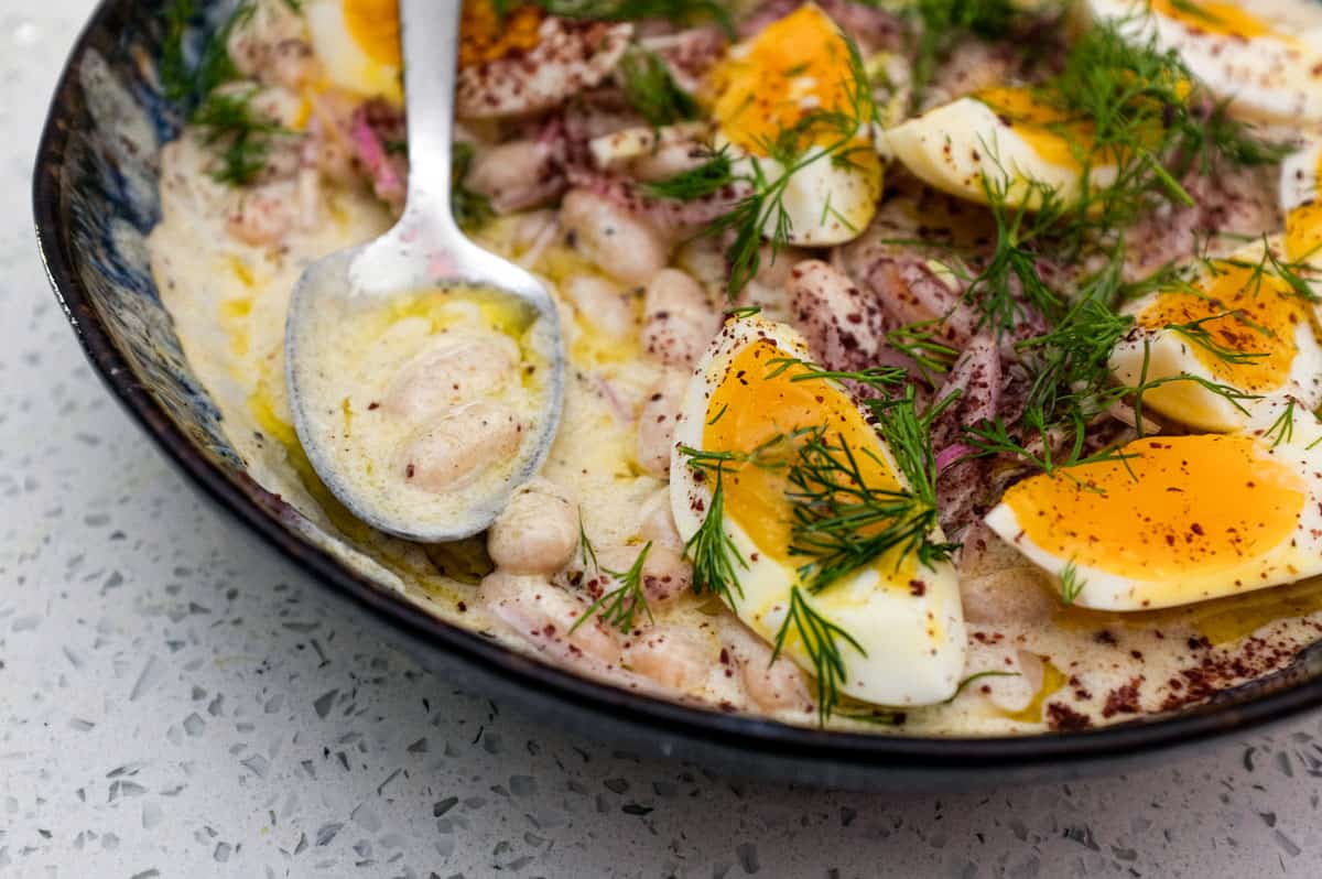 A Turkish bean salad with eggs, onion and dill - Fasulye Piyaz