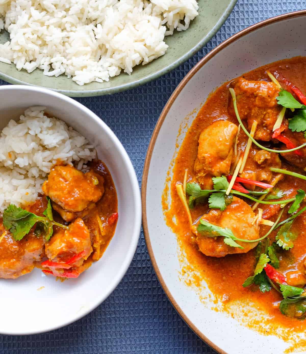Bowls of Burmese chicken curry with rice