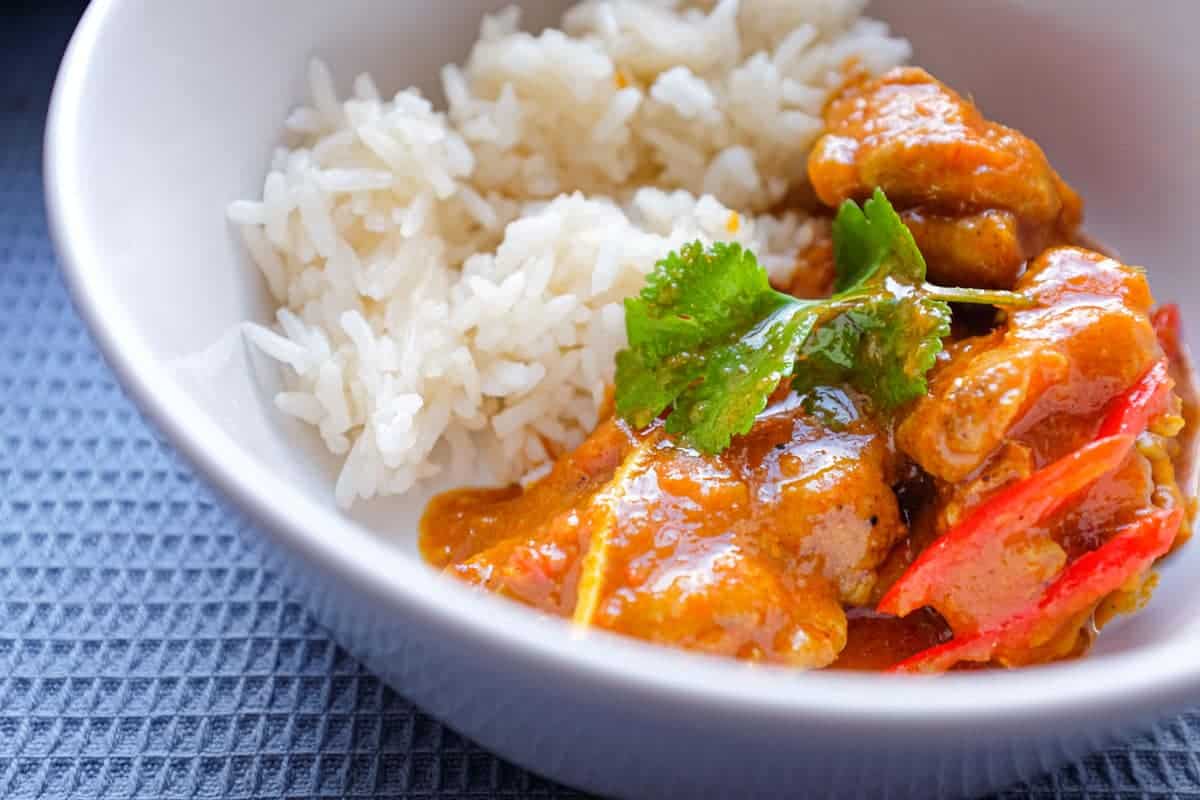 A bowl of Burmese chicken curry with rice