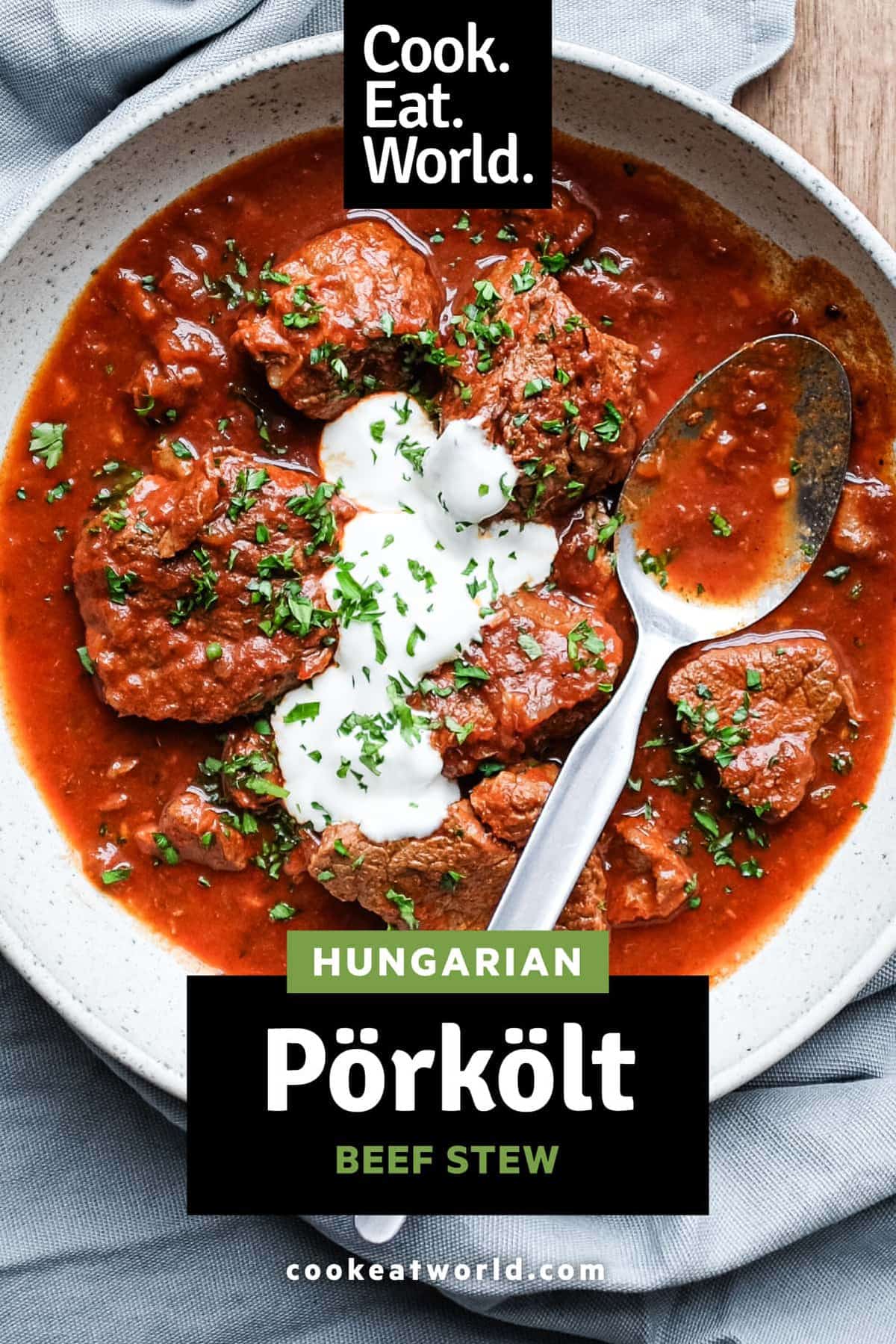 A bowl of Hungarian Pörkölt Beef Stew with a spoon