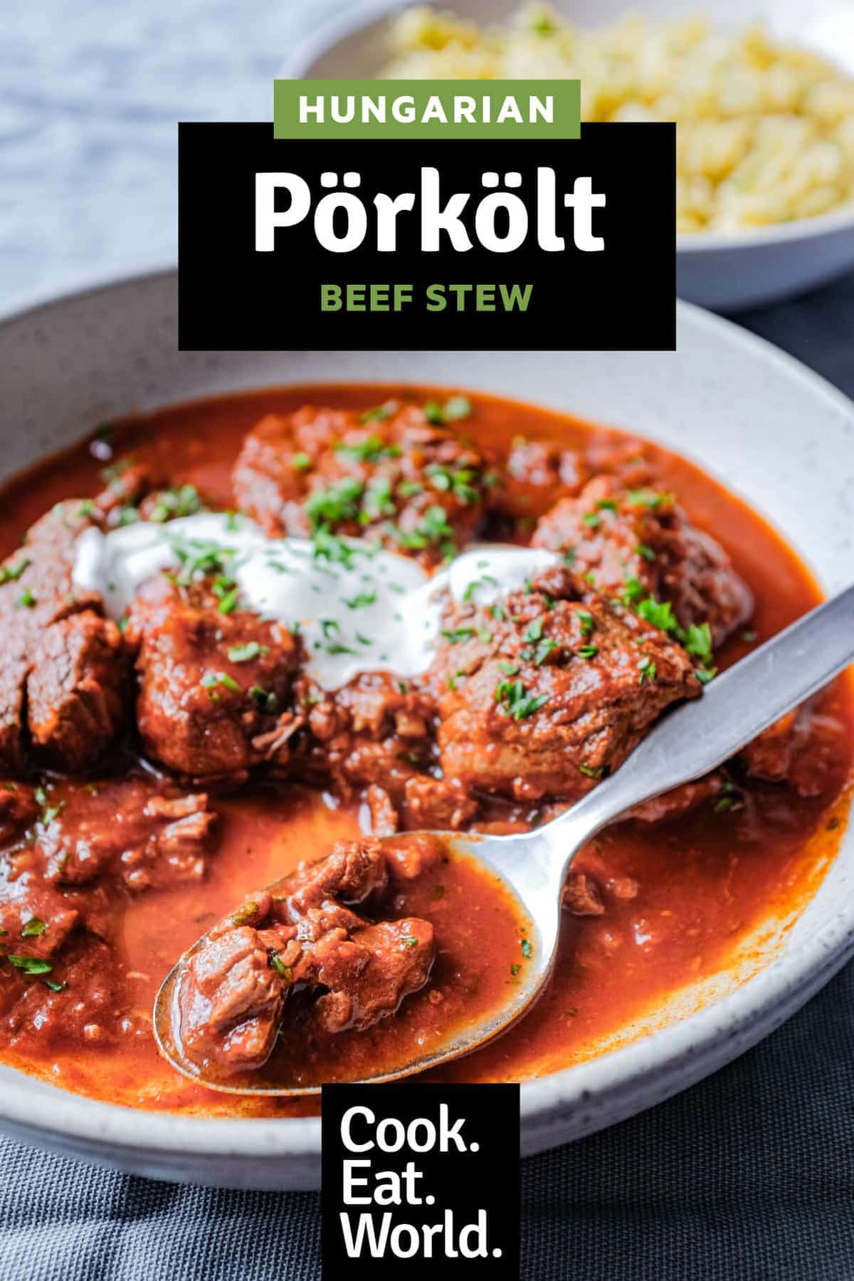 A bowl of Hungarian Pörkölt Beef Stew with a spoon