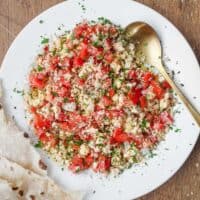 A bowl of Lebanese Shanklish Salad with a spoon