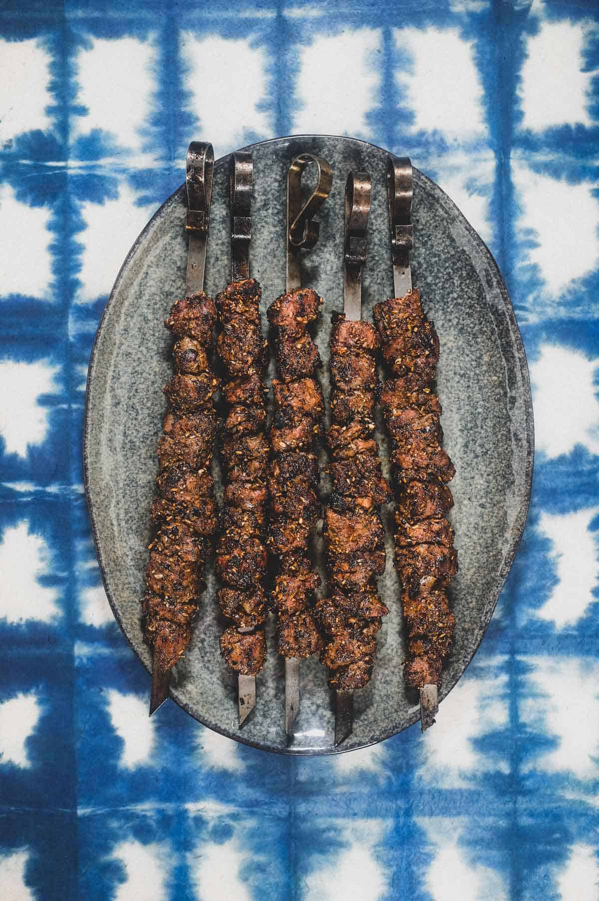 Chinese Xinjiang Lamb Skewers on a platter