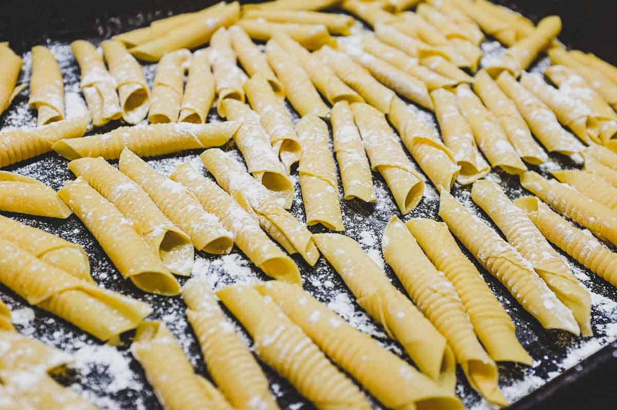 Garganelli pasta resting on a platter before cooking