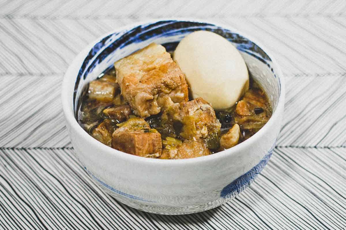 A bowl of Vietnamese Thit Kho (Braised pork belly) with a whole boiled egg