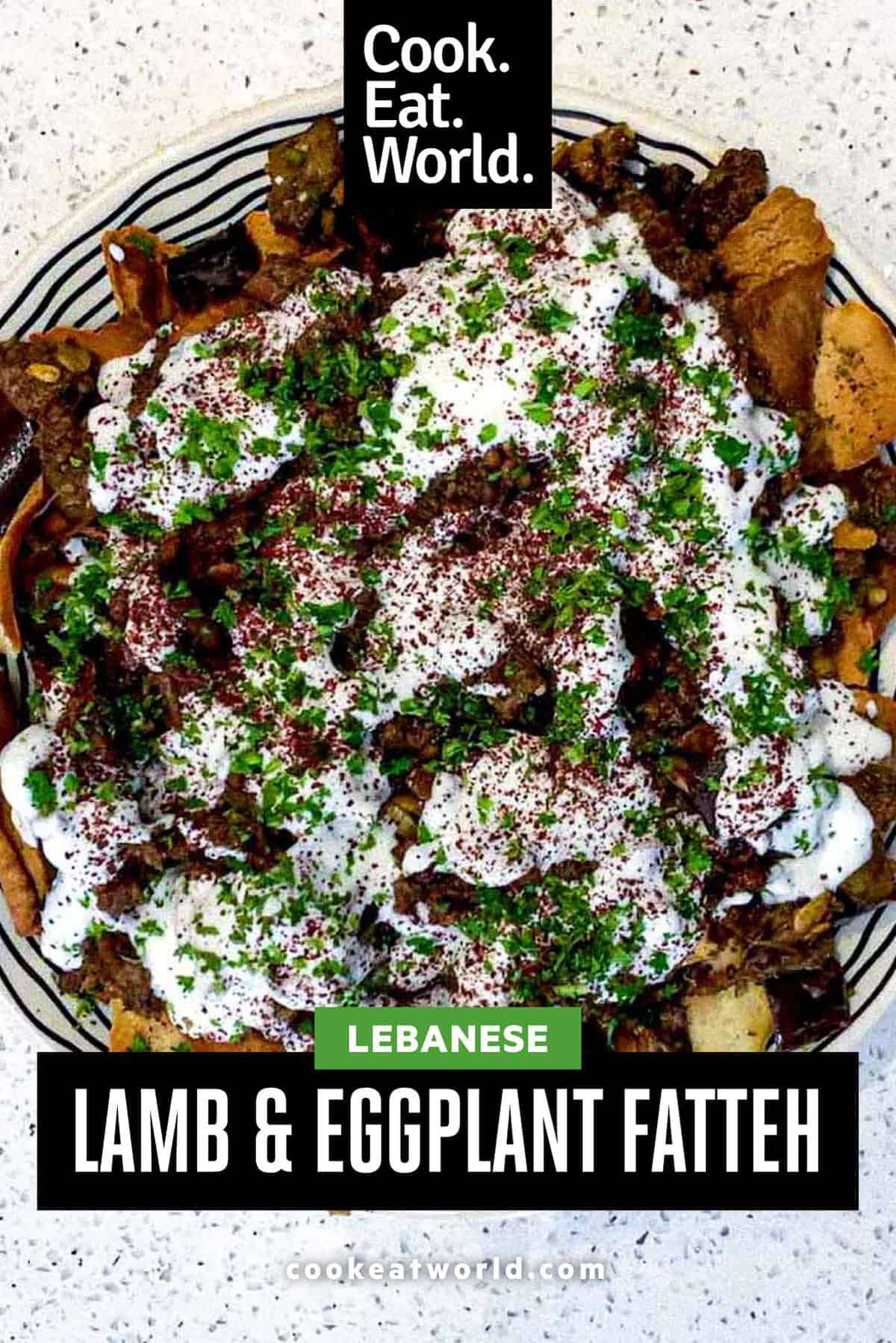 a platter of Lamb & Eggplant Fatteh garnished with fresh parsley and sumac