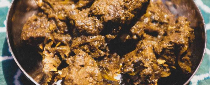A small copper balti pan holds a portion of Indian Beef Balti