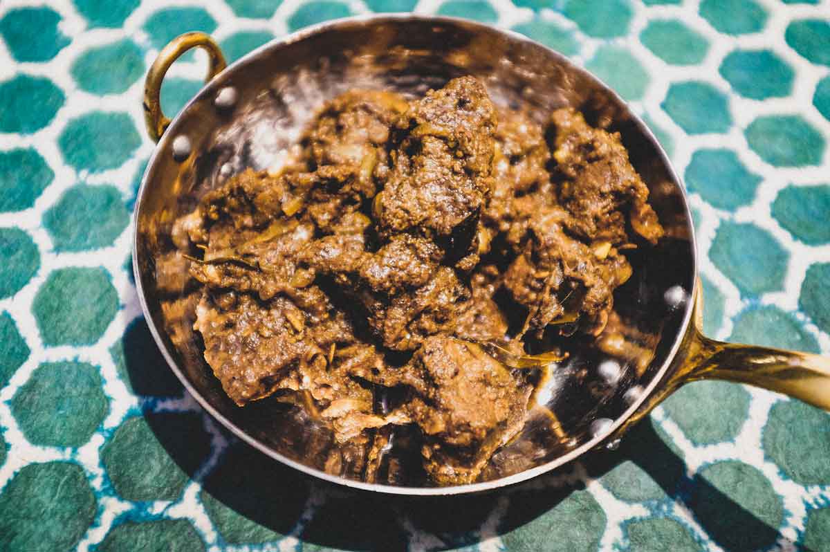 A small copper balti pan holds a portion of Indian Beef Balti