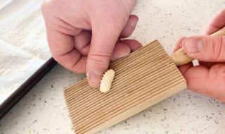 Rolling Malloreddus pasta on a Malloreddus Gnocchi Board