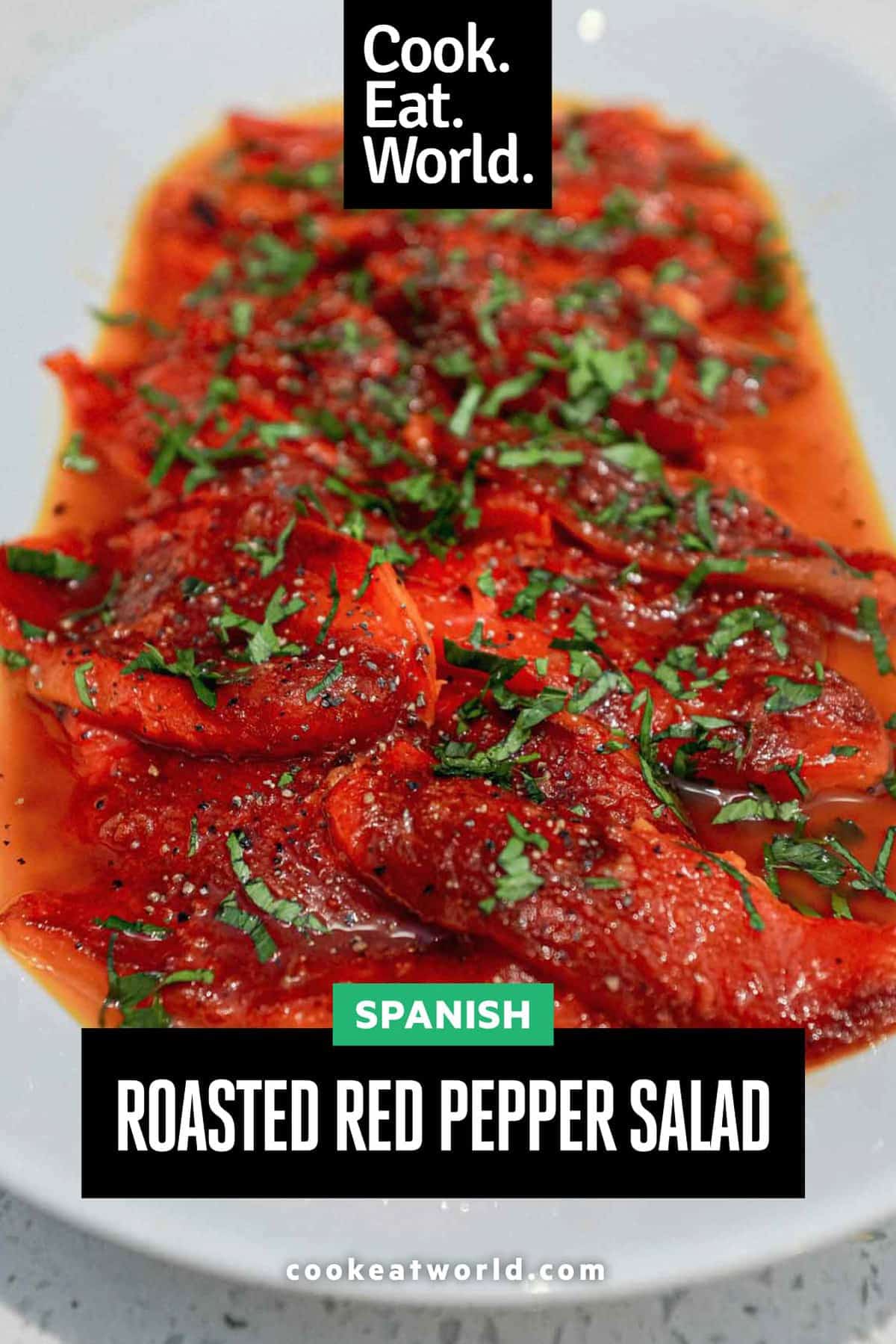 A platter of roasted red peppers, garnished with fresh herbs