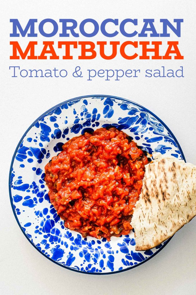 Moroccan Matbucha in a vibrant blue meze bowl. Peppers and tomatoes are stewed to a thick, tangy paste.