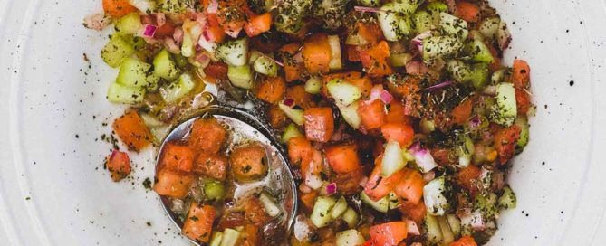 Shirazi Salad - a combination of tomatoes, onion and cucumber scattered with dried mint