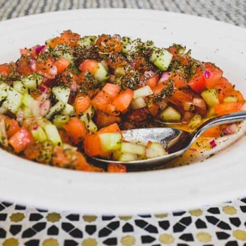Shirazi Salad - a combination of tomatoes, onion and cucumber scattered with dried mint