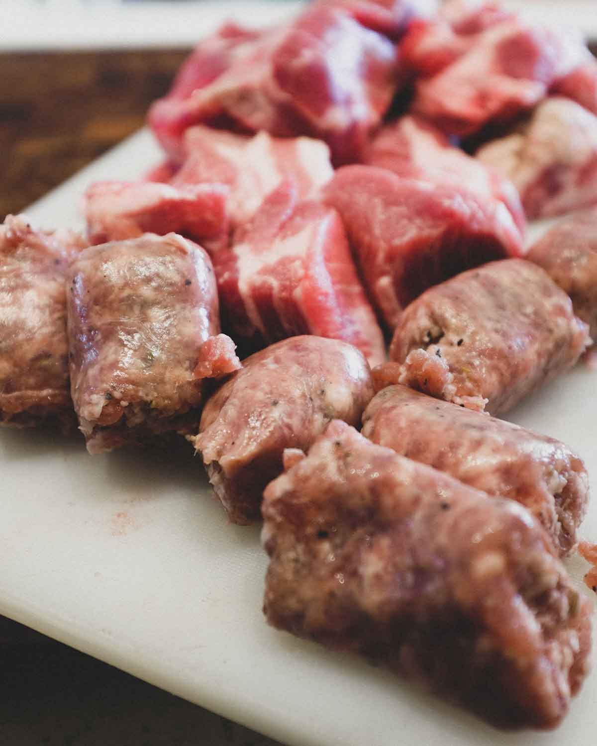 Pork sausage and pieces on a cutting board