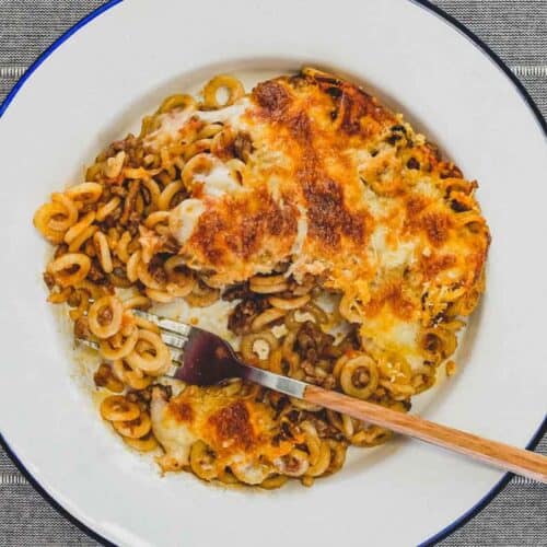 A plate of baked pasta rings called Anelleti Al Forno