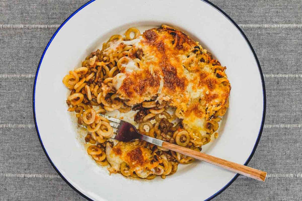 A plate of baked pasta rings called Anelleti Al Forno