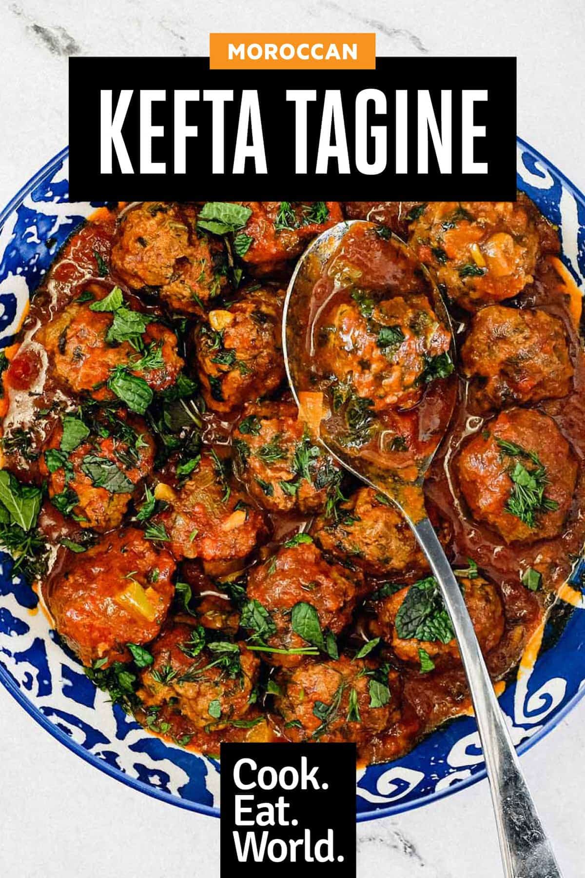 A large bowl of Moroccan Kefta (meatballs) tagine with a spoon.