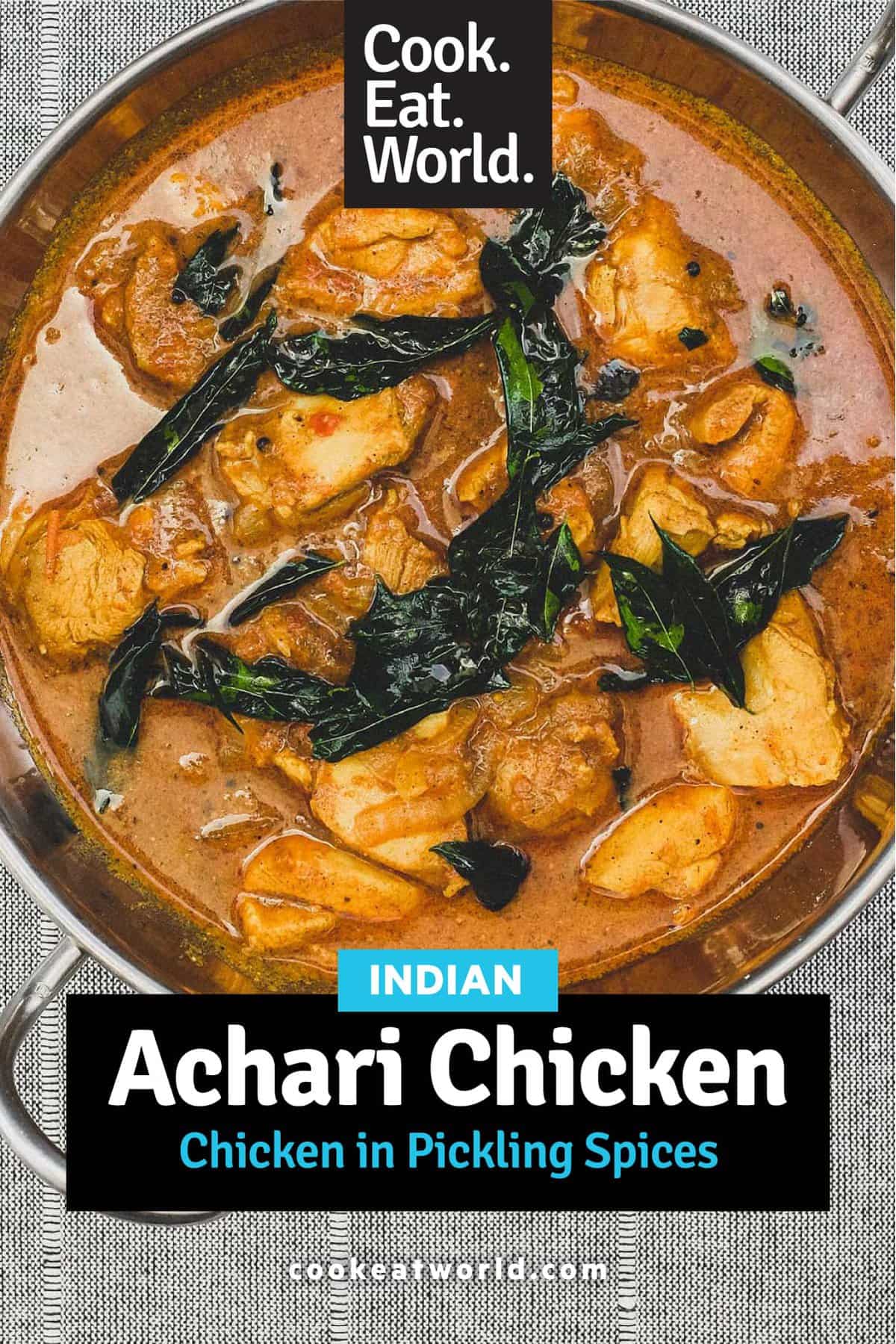 Achari Chicken in a silver bowl scattered with fried curry leaves