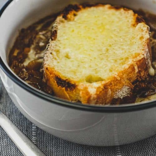 A small bowl of French Onion Soup with Gruyere Crouton