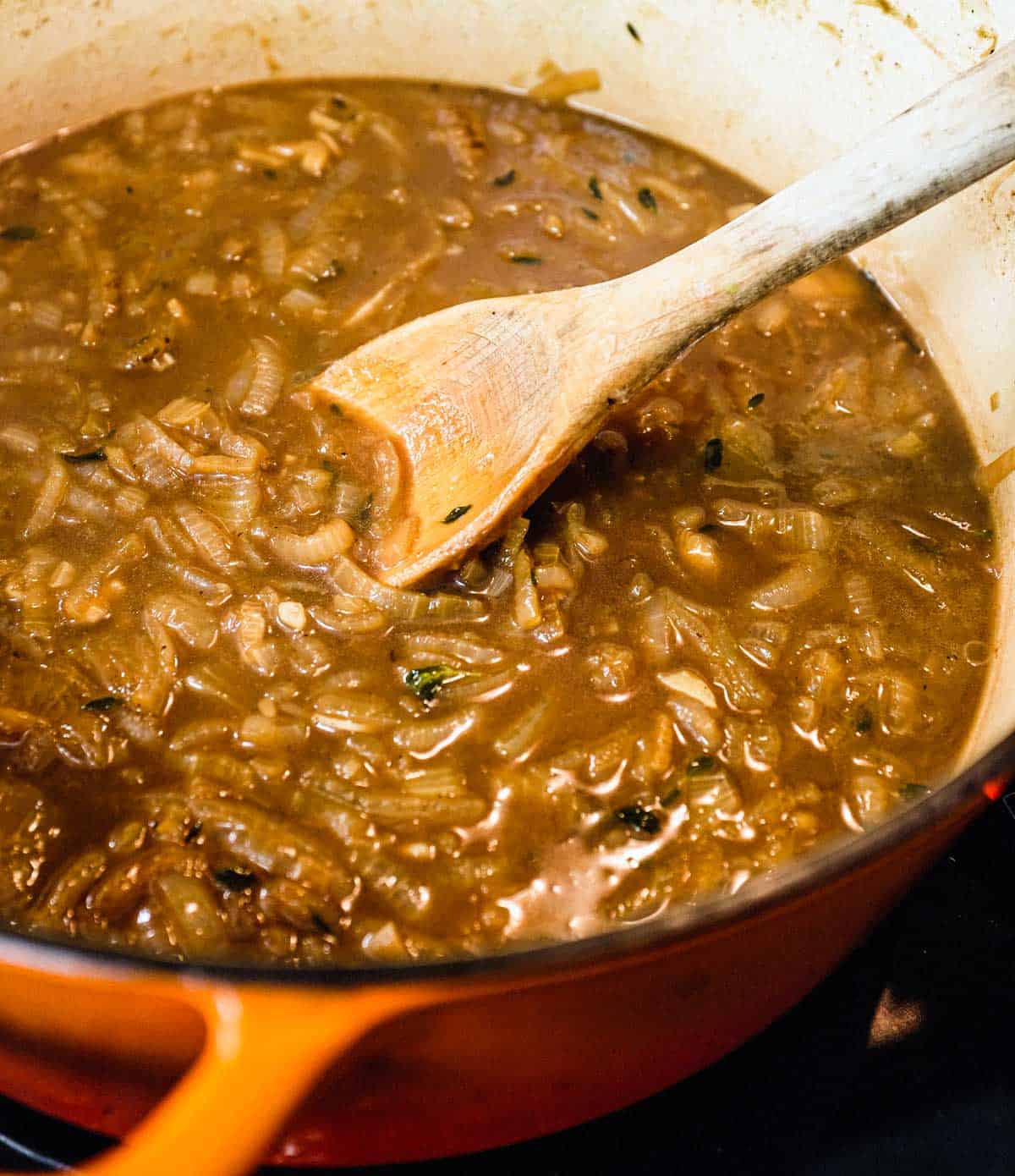 French Onion Soup simmering in a pan