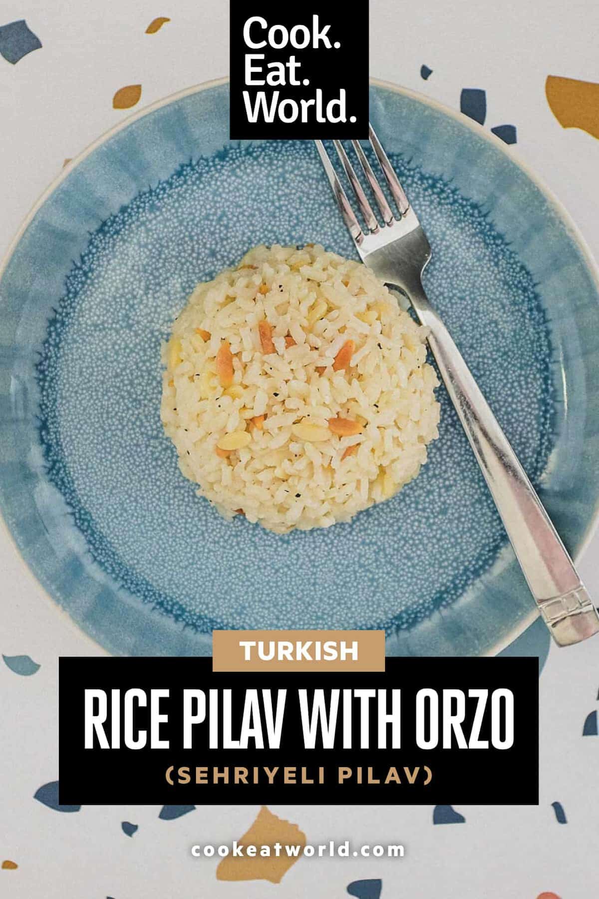 A plate with a dome of Turkish rice pilav and a fork.