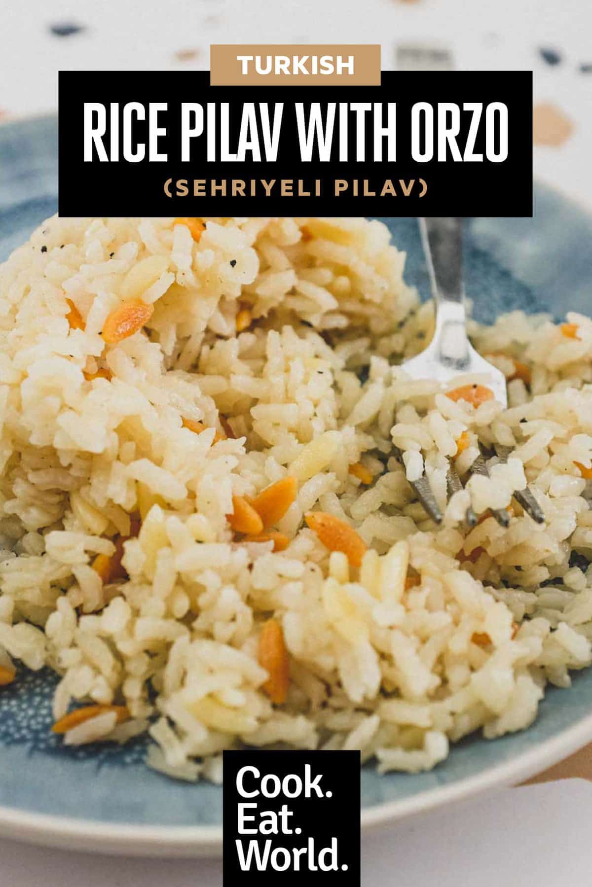A plate with a dome of Turkish rice pilav and a fork.