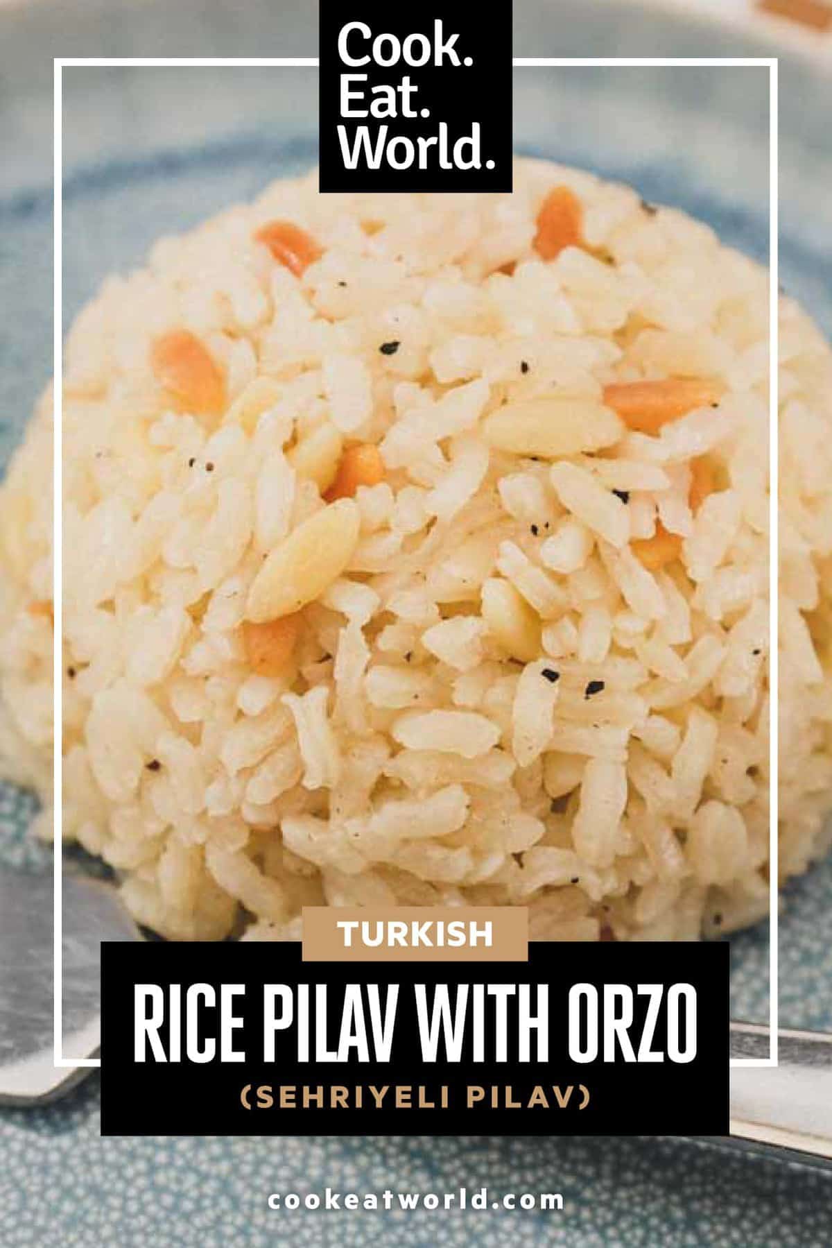 A plate with a dome of Turkish rice pilav and a fork.