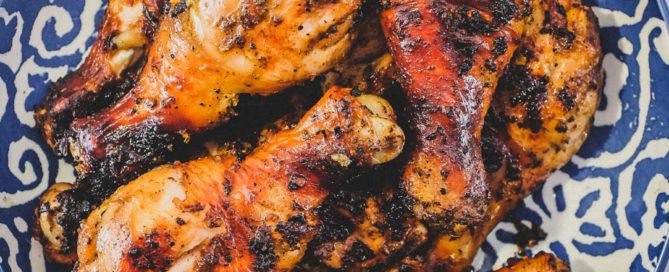 A bowl of cha-style chicken grilled over hot coals. Thai-Style Grilled Chicken (Gai Yang)