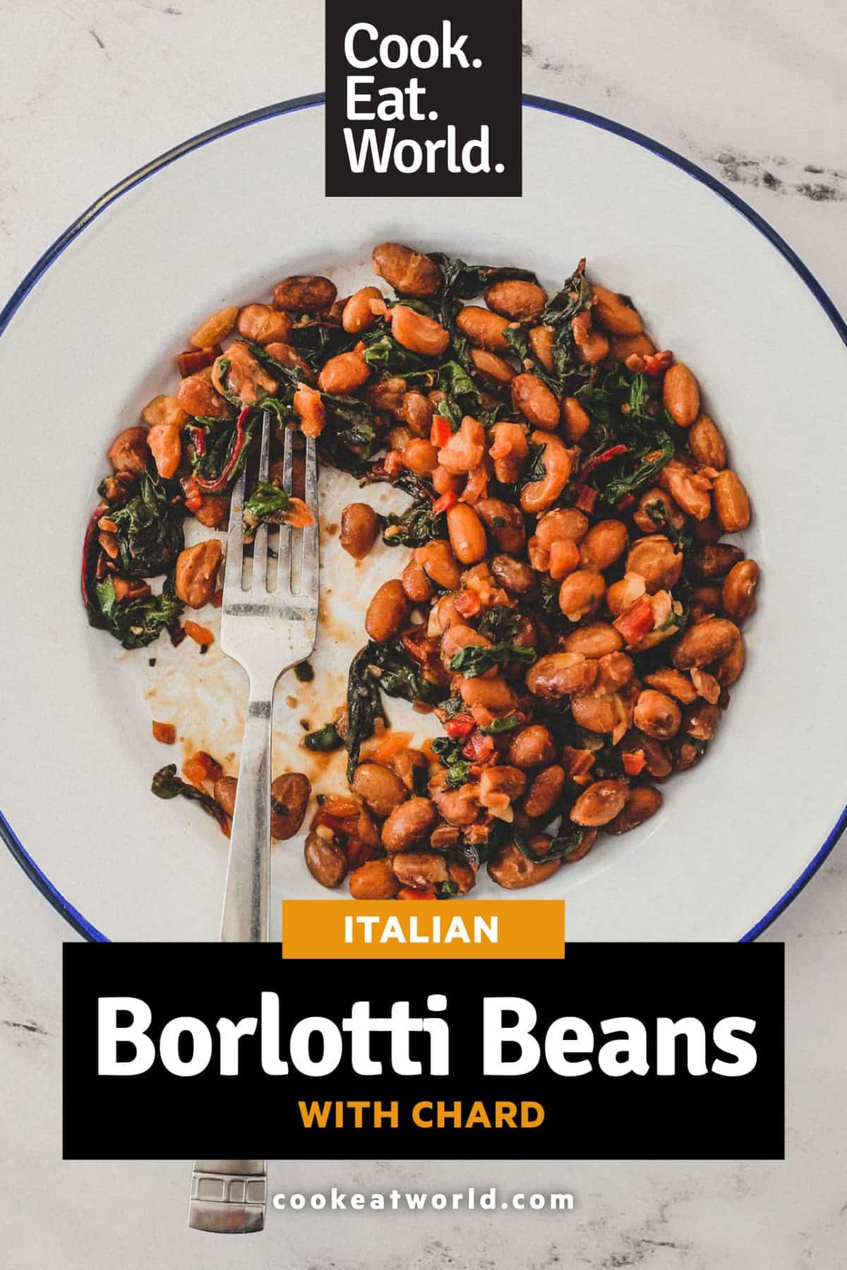 Borlotti beans cooked with chard (silverbeet) on a plate with a fork