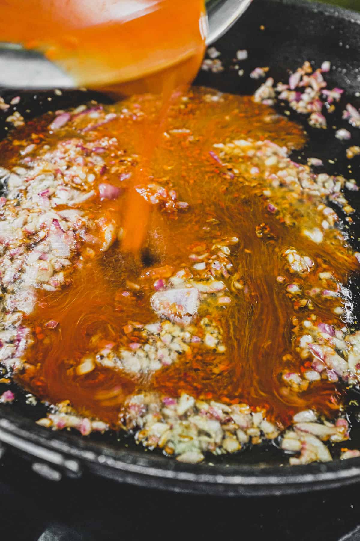 Korean chilli with soy, sugar and water poured over lightly fried onion