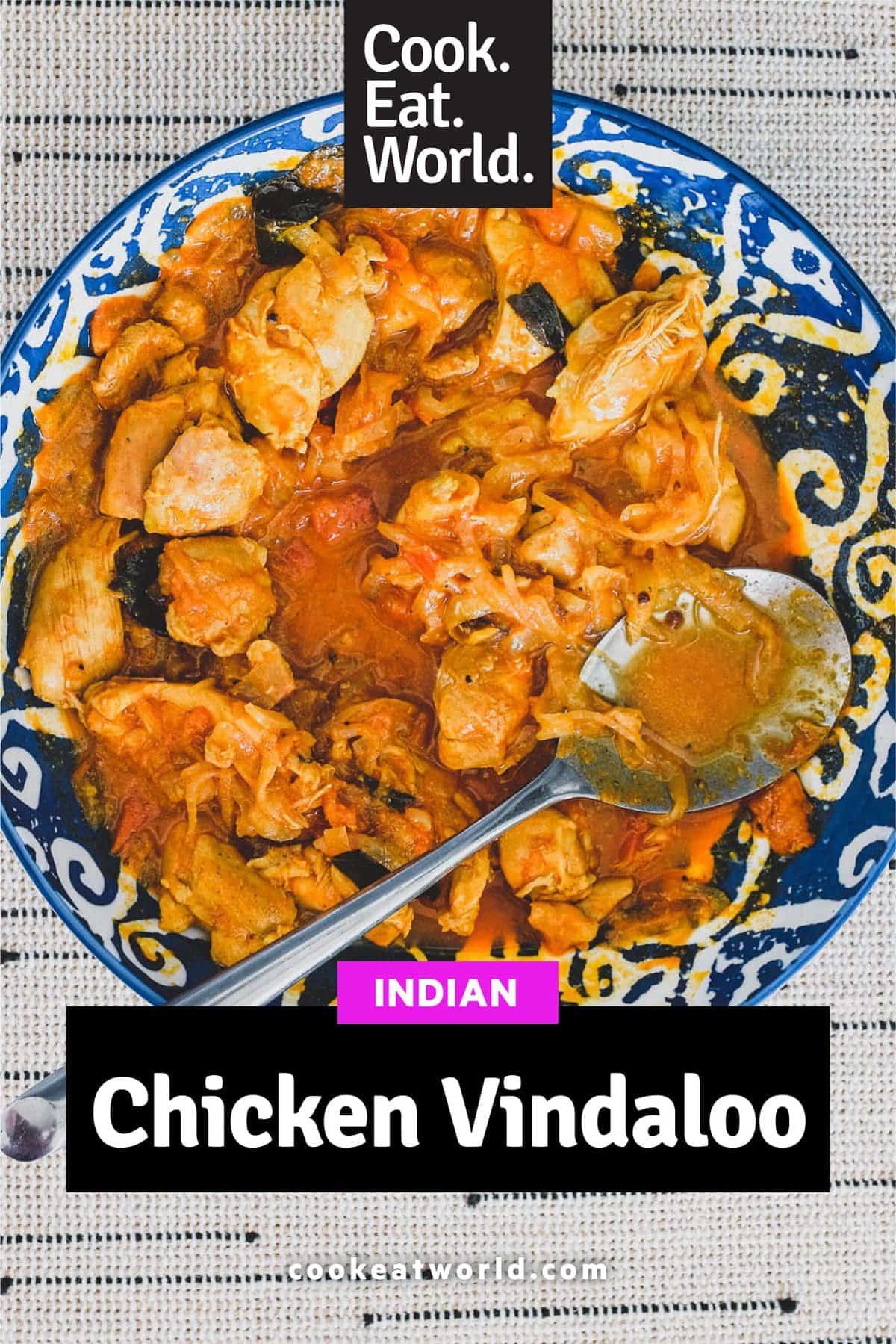 Chicken cooked with vinegar. spices, garlic and tomato.